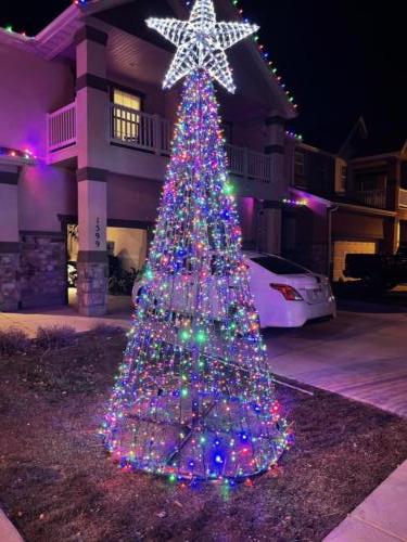 Cone Tree With Red Green Orange and Blue lights along with Color Changing Star